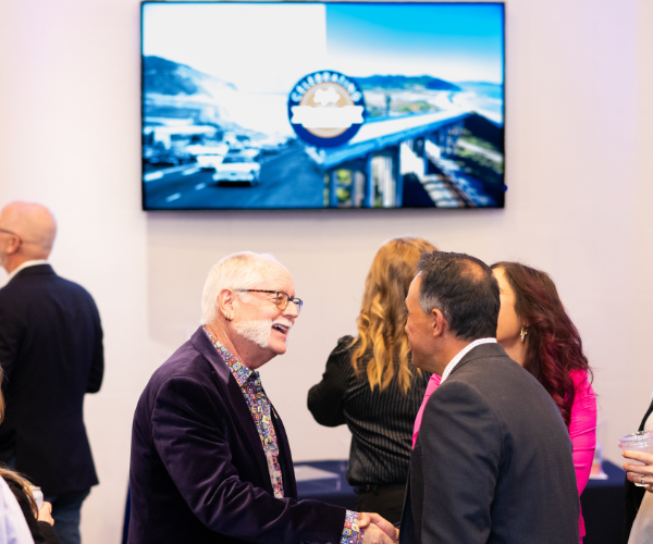 Gerry shaking hands with a tourism accelerator member