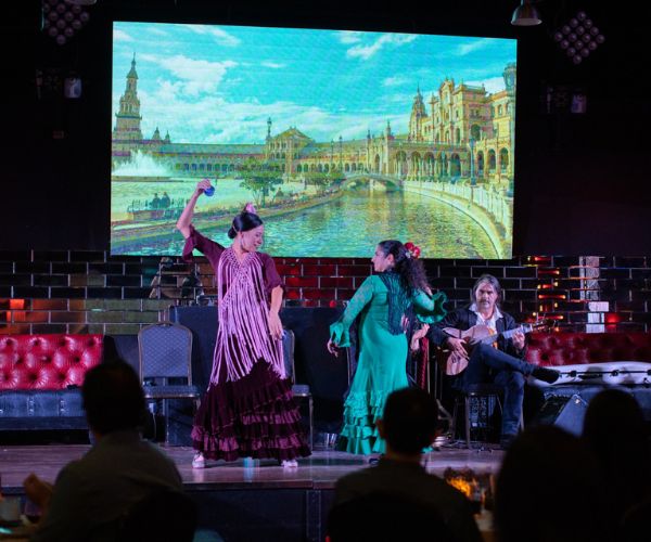 Two women dancing at Cafe Seville