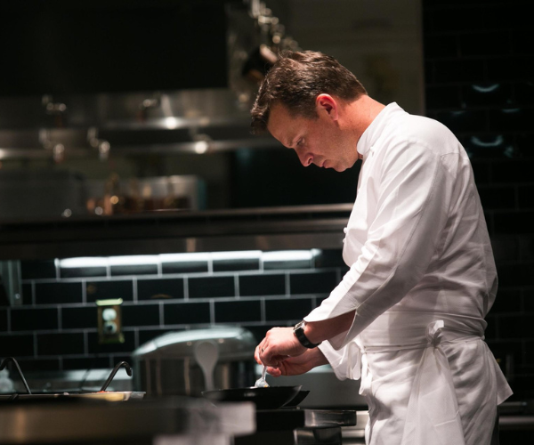 a chef working on the cook line in at restaurant 